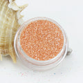 evol crushed ice orange dust face glitter